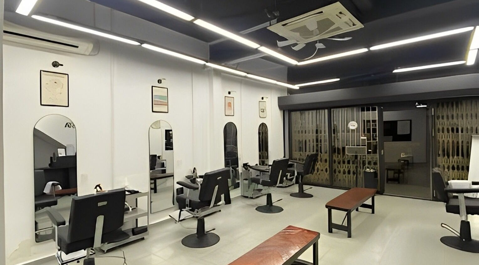 Modern interior of Cuts & Cloud Mawar salon in Pontian, Johor, MY with sleek chairs and mirrors.