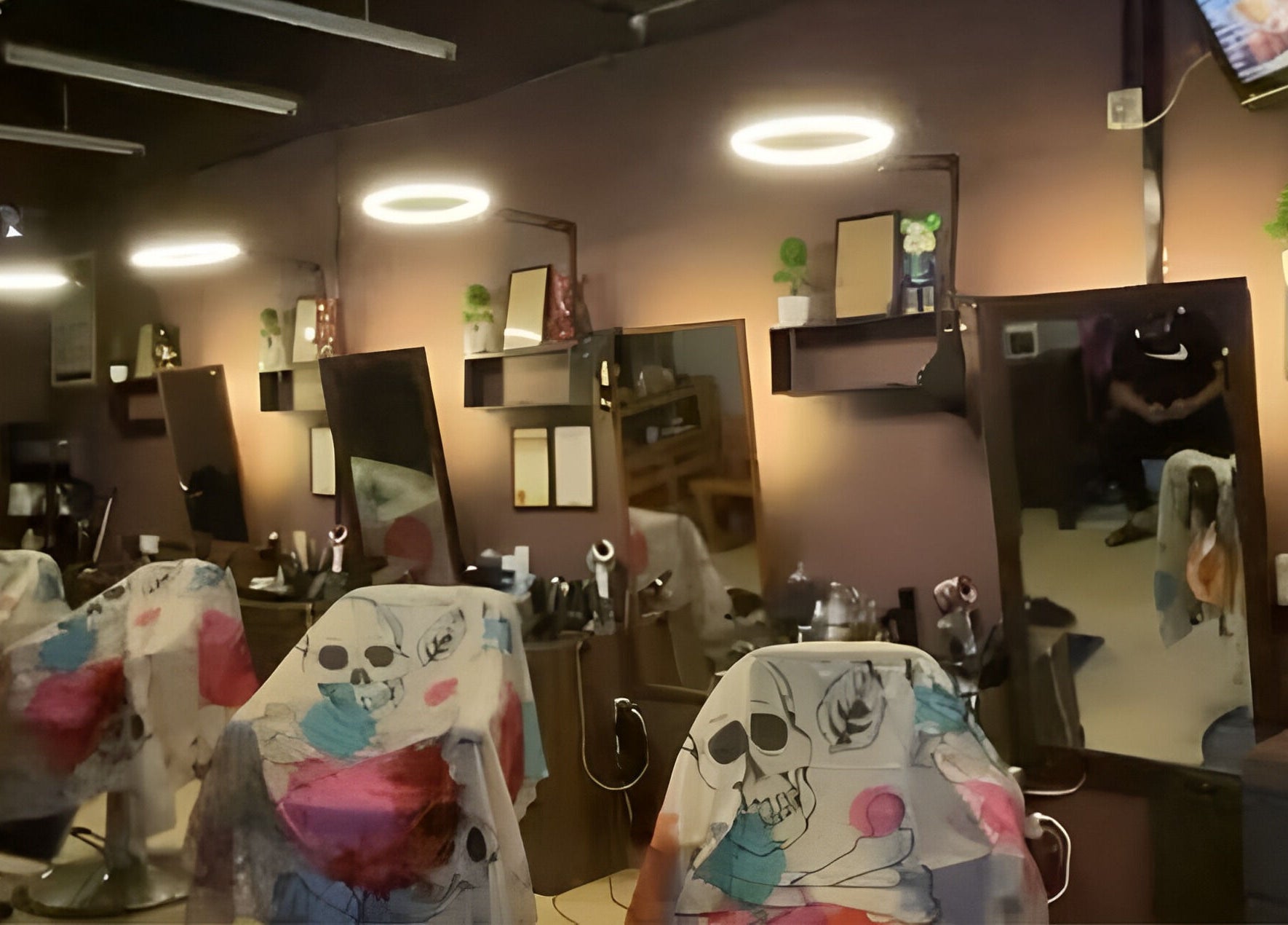 Chic salon interior at Cuts & Cloud Damai in Pontian, Johor, MY with stylish decor and mirrors.
