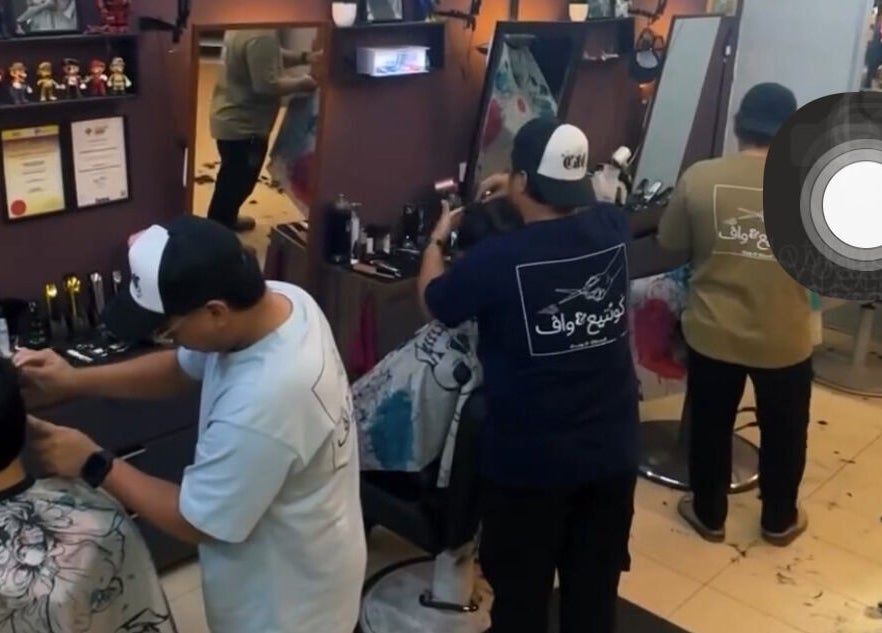 Stylists at work in Cuts & Cloud Damai, Pontian, Johor, MY. Modern salon interior with attentive haircare.