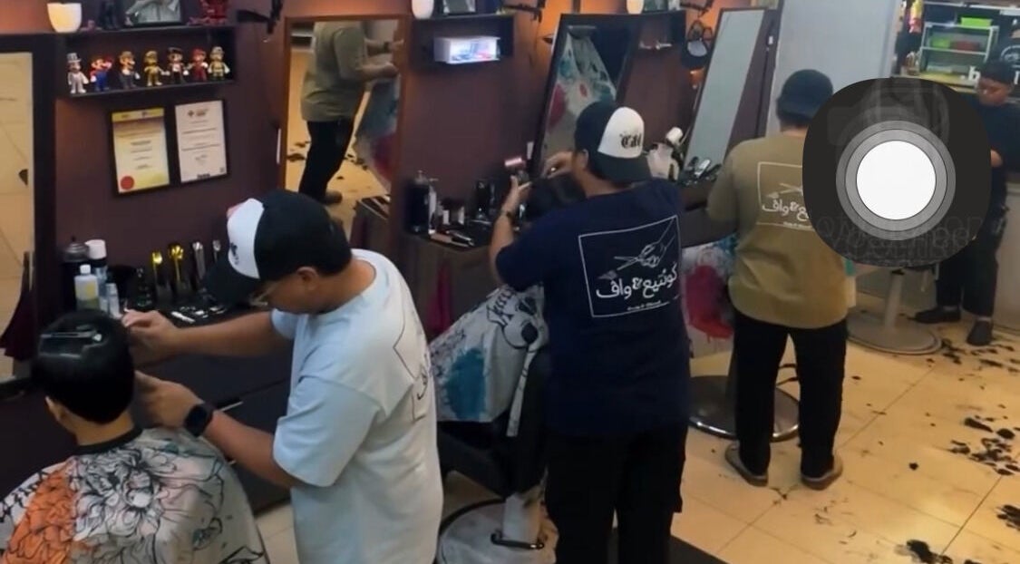 Stylists at work in Cuts & Cloud Damai, Pontian, Johor, MY. Modern salon interior with attentive haircare.