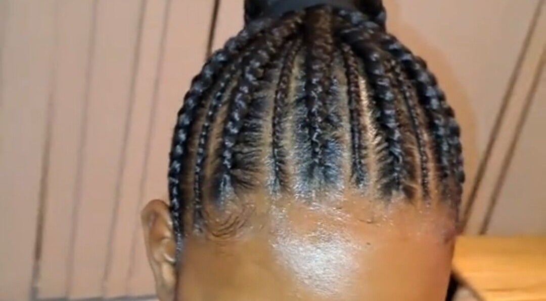 Intricate braids at Antina Hair, London, England, GB showcasing expert hairstyling.