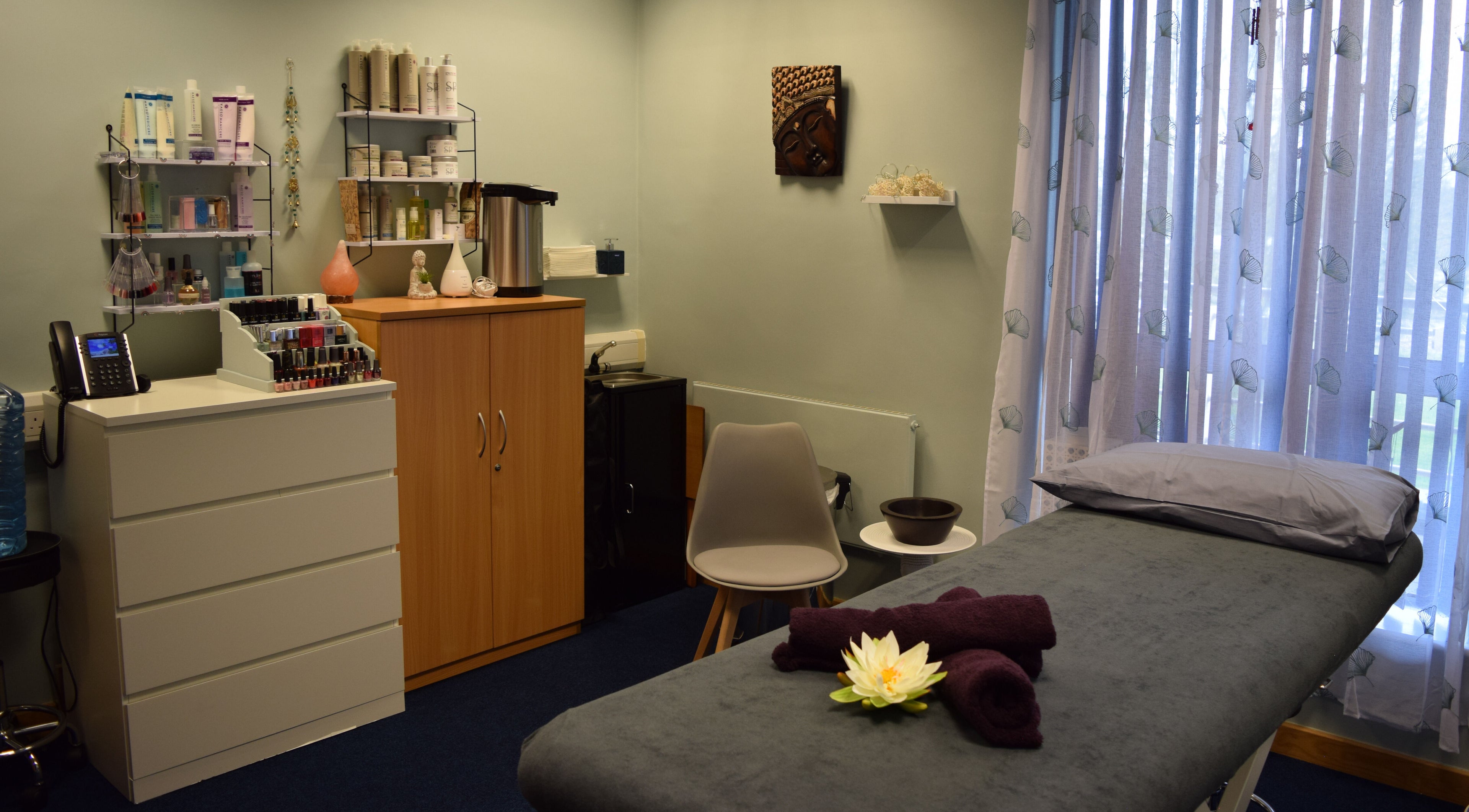 Serene therapy room at Vickie Wood Holistic Therapies, Silsoe, England, GB, with massage bed and natural decor.