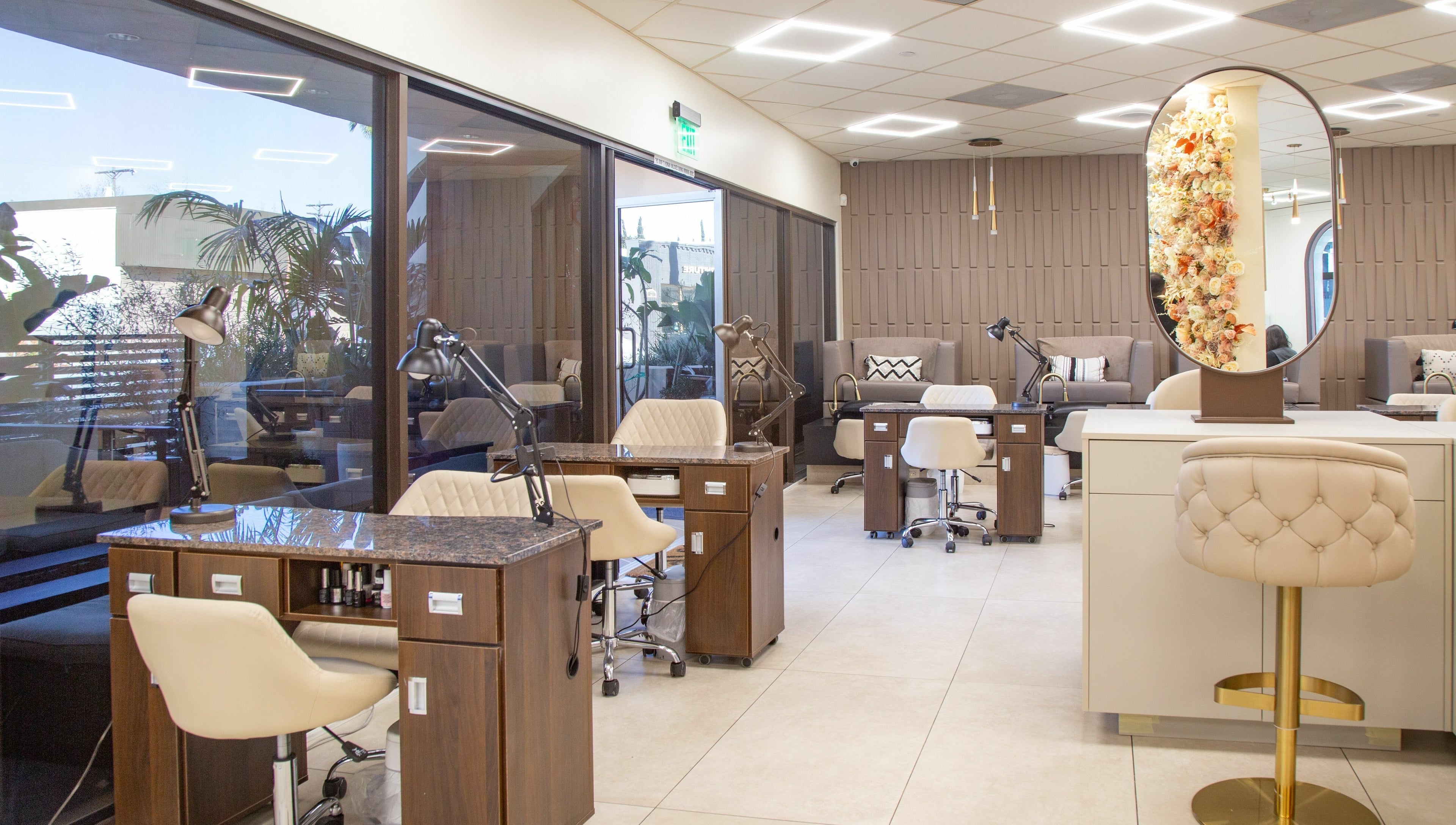 Chic interior of Omorfia Salon and Spa in Glendale, California, US featuring stylish nail stations and decor.