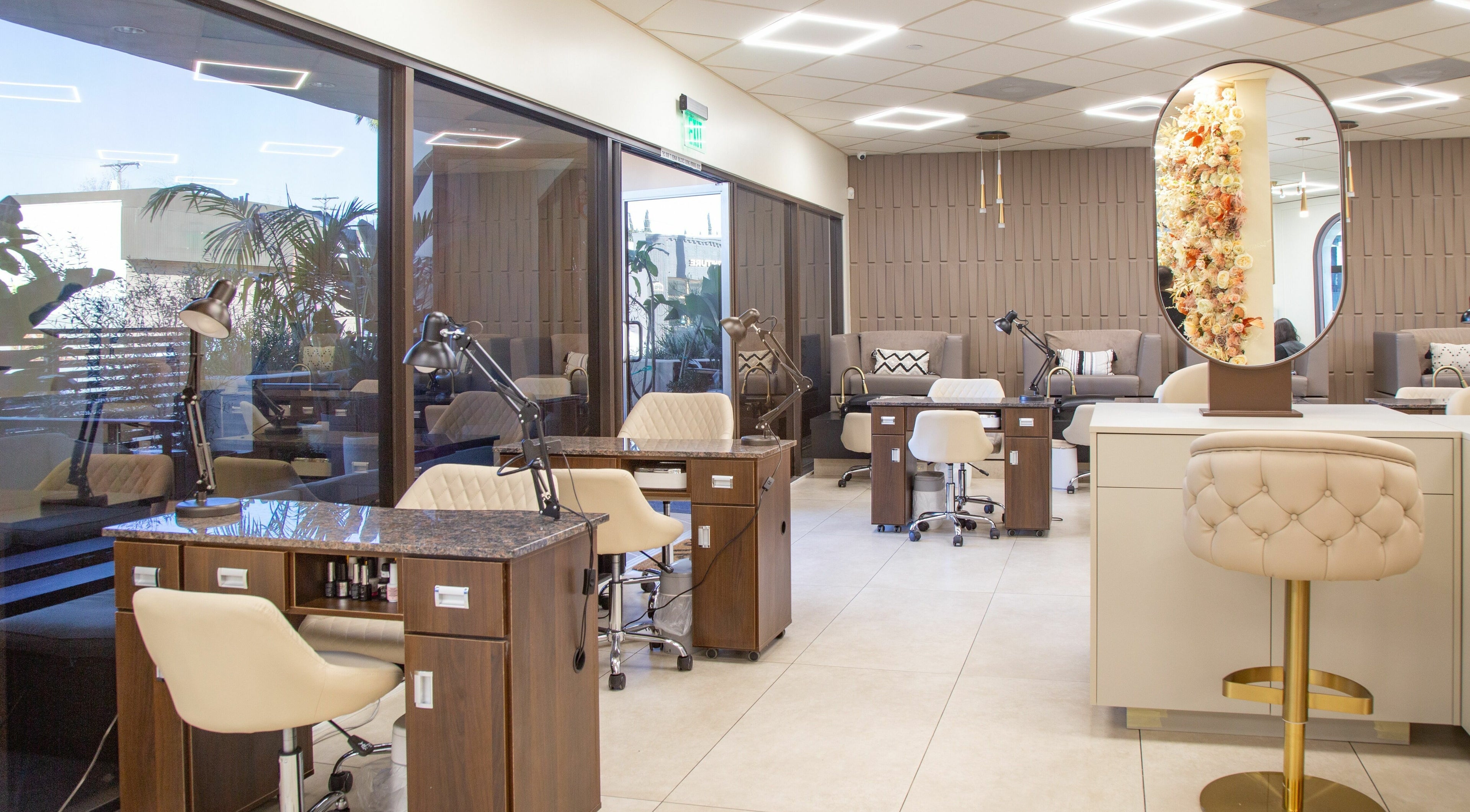 Chic interior of Omorfia Salon and Spa in Glendale, California, US featuring stylish nail stations and decor.