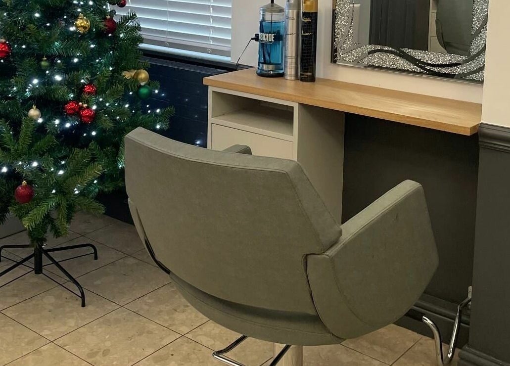 Cozy styling station at Corner Hairdressing, Lindfield, England with a festive Christmas tree beside it.