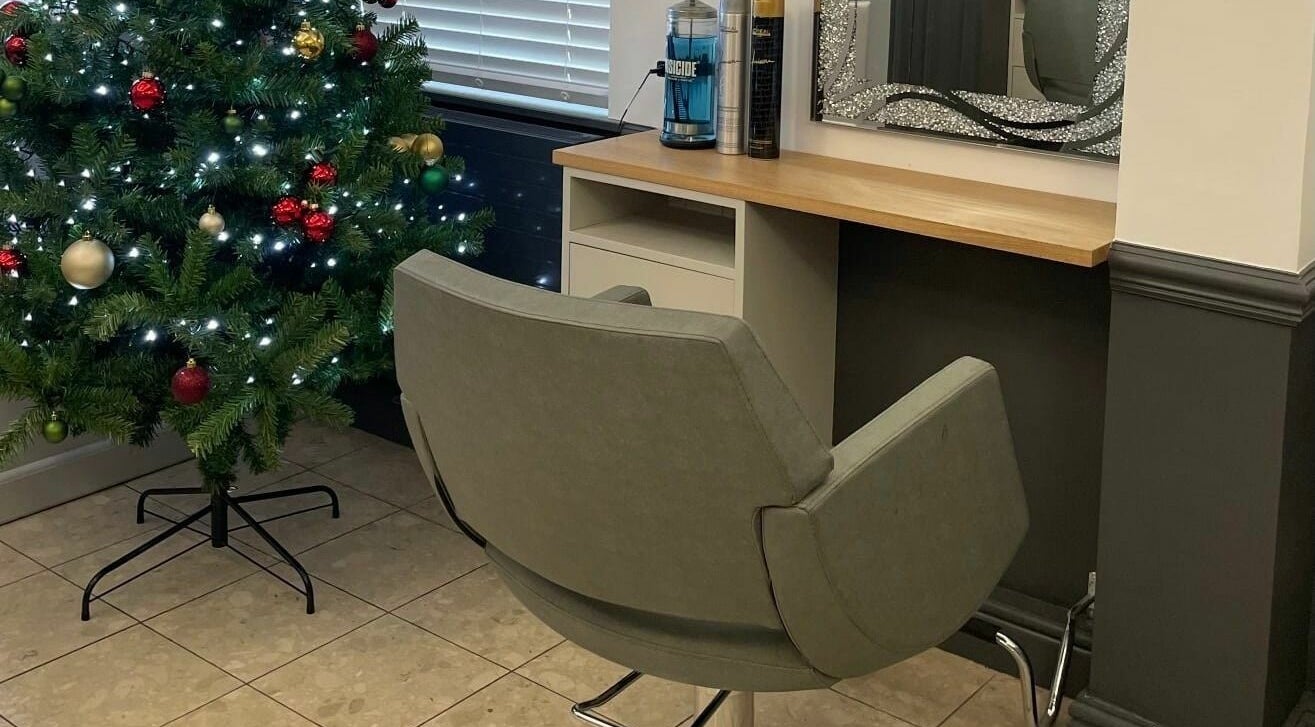 Cozy styling station at Corner Hairdressing, Lindfield, England with a festive Christmas tree beside it.