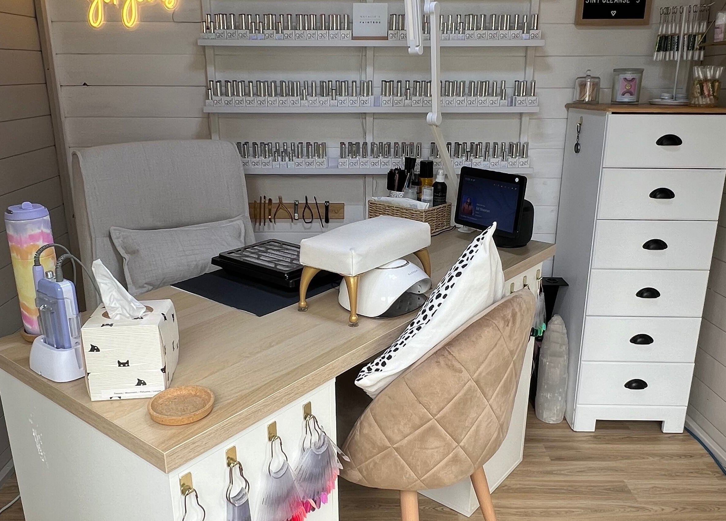 Natalies Paint Box Nails cozy workspace with nail polish display in Birmingham, England, GB.