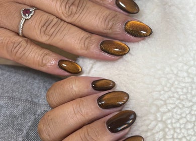 Glistening brown nails from Natalies Paint Box Nails, Birmingham, England, GB, showcase elegant nail artistry.