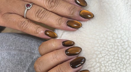 Glistening brown nails from Natalies Paint Box Nails, Birmingham, England, GB, showcase elegant nail artistry.