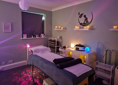 Tranquil treatment room at Nourish Holistic Therapy, Milton Keynes, England, GB, with ambient lighting and decor.