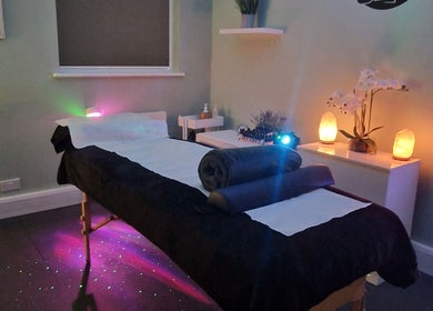 Relaxing massage room at Nourish Holistic Therapy, Milton Keynes, England, GB with dim lighting and soft decor.