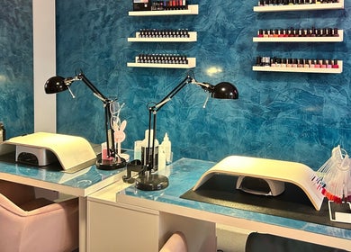 Chic nail station at Alexander Aromatics Wellness Studio in Dreghorn, Scotland, GB with vibrant blue walls.