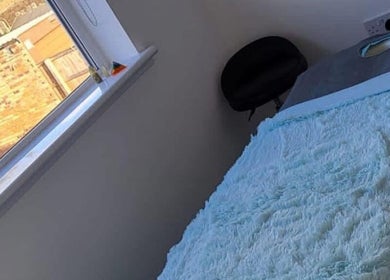 Tranquil massage room at Alexander Aromatics Wellness Studio in Dreghorn, Scotland, GB with soft, inviting decor.