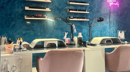 Nail station at Alexander Aromatics Wellness Studio, Girdle Toll, Scotland, GB with blue walls and stylish decor.
