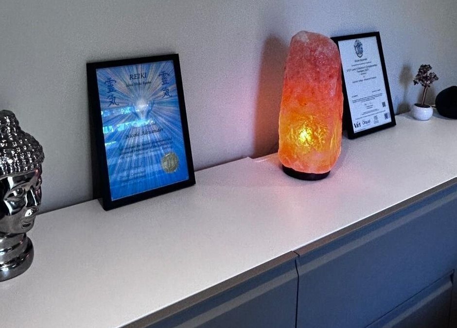 Decor at Alexander Aromatics Wellness Studio, Girdle Toll, Scotland. Buddha statue, salt lamp, and Reiki certificate.