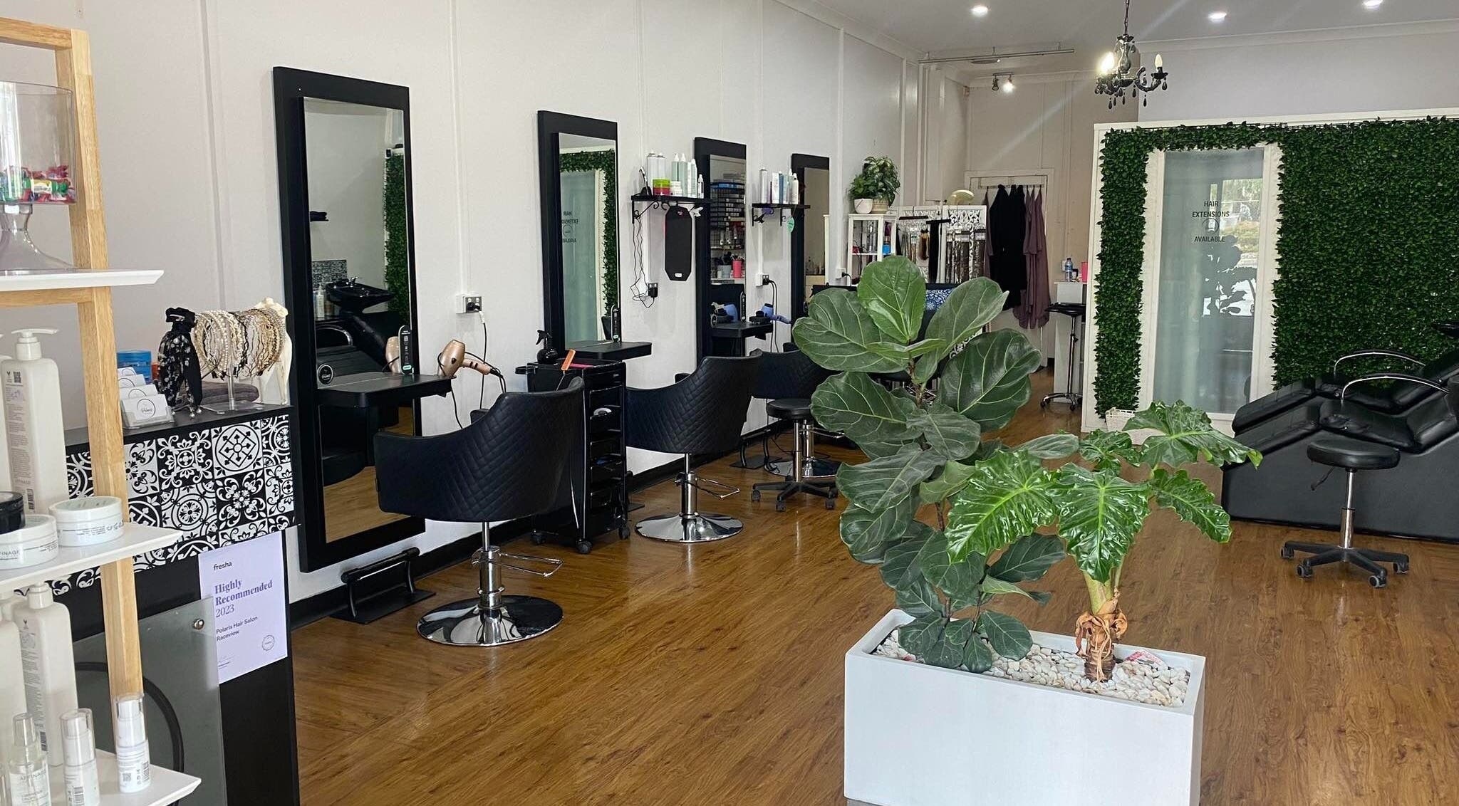 Interior of Polaris Hair Salon Raceview with stylish chairs and lush greenery in Raceview, Queensland, AU.