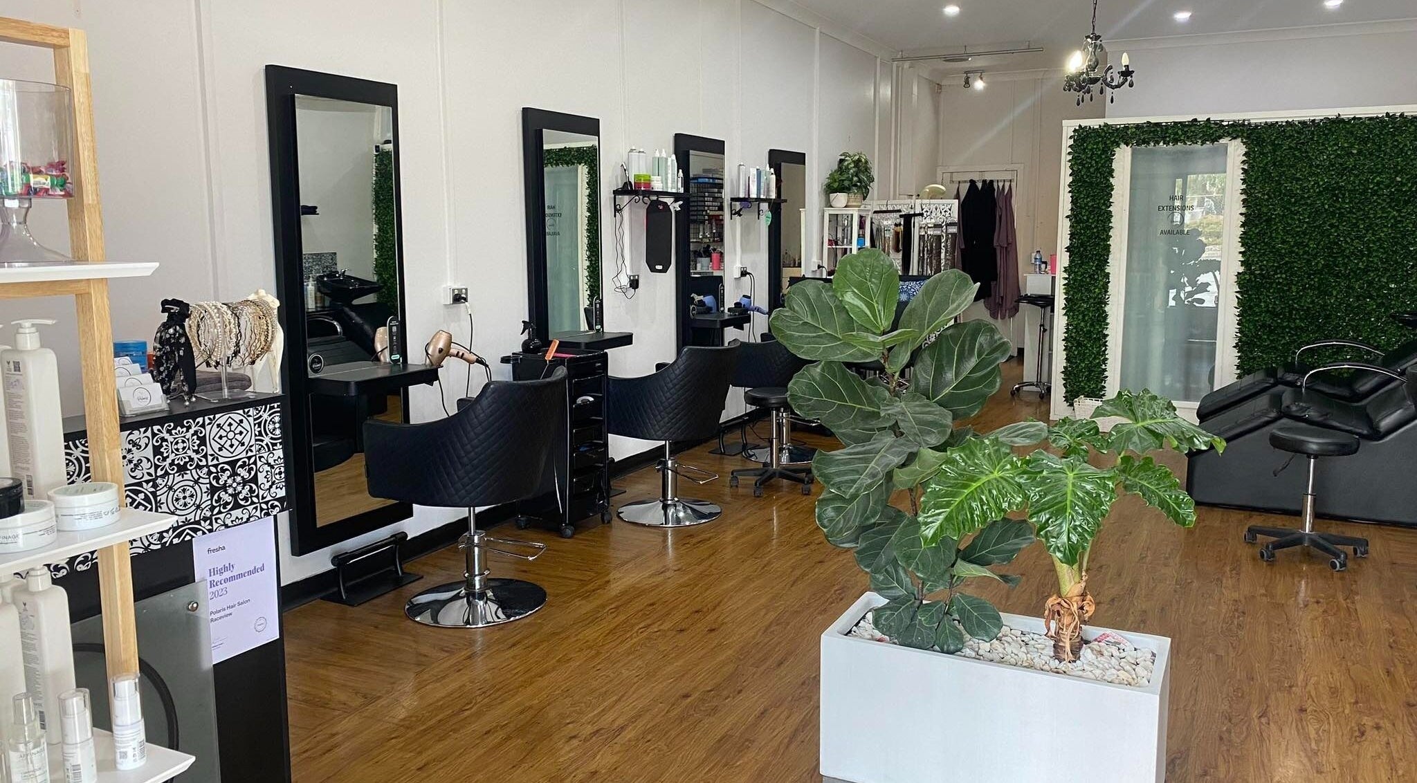 Interior of Polaris Hair Salon Raceview with stylish chairs and lush greenery in Raceview, Queensland, AU.