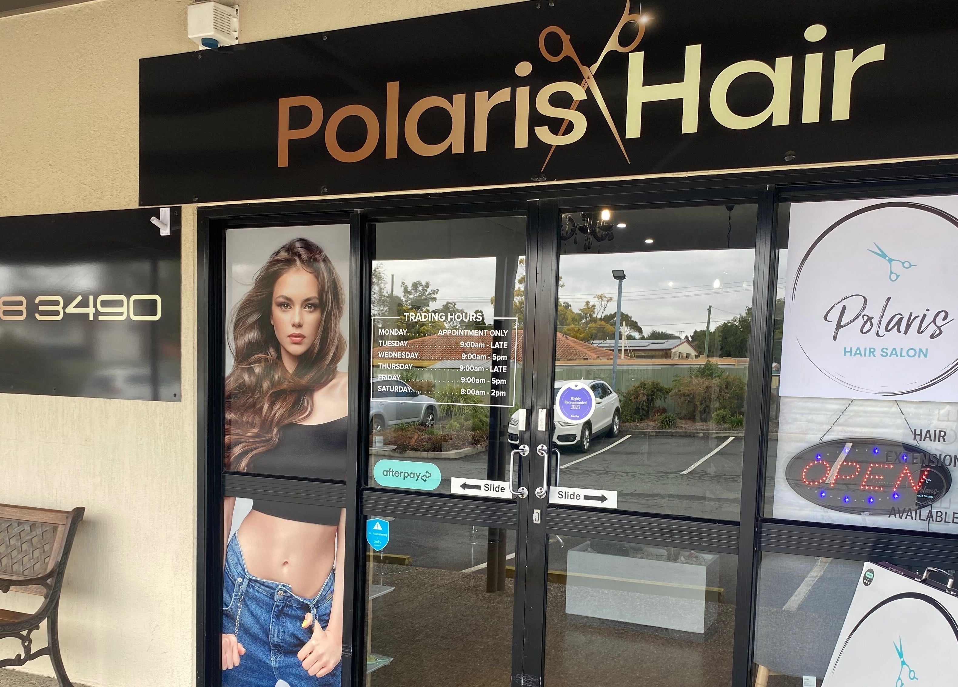 Entrance of Polaris Hair Salon Raceview with signage and glass doors in Raceview, Queensland, AU.