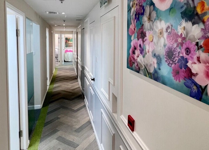 Bright hallway with floral artwork at Honeypot Wax Boutique (Central), Hong Kong Island, HK.