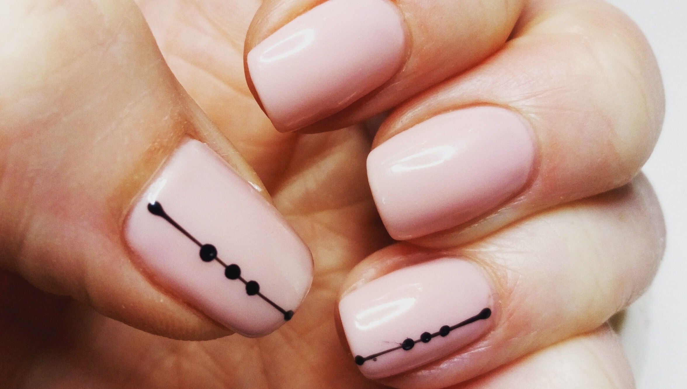 Elegant nail art with black dots at Haven Beauty Clinic, Nenagh, County Tipperary, IE.