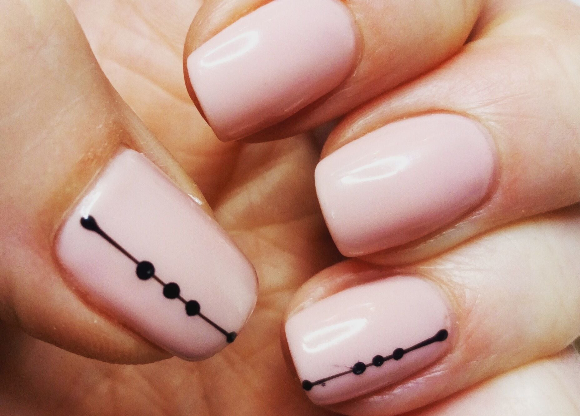 Elegant nail art with black dots at Haven Beauty Clinic, Nenagh, County Tipperary, IE.