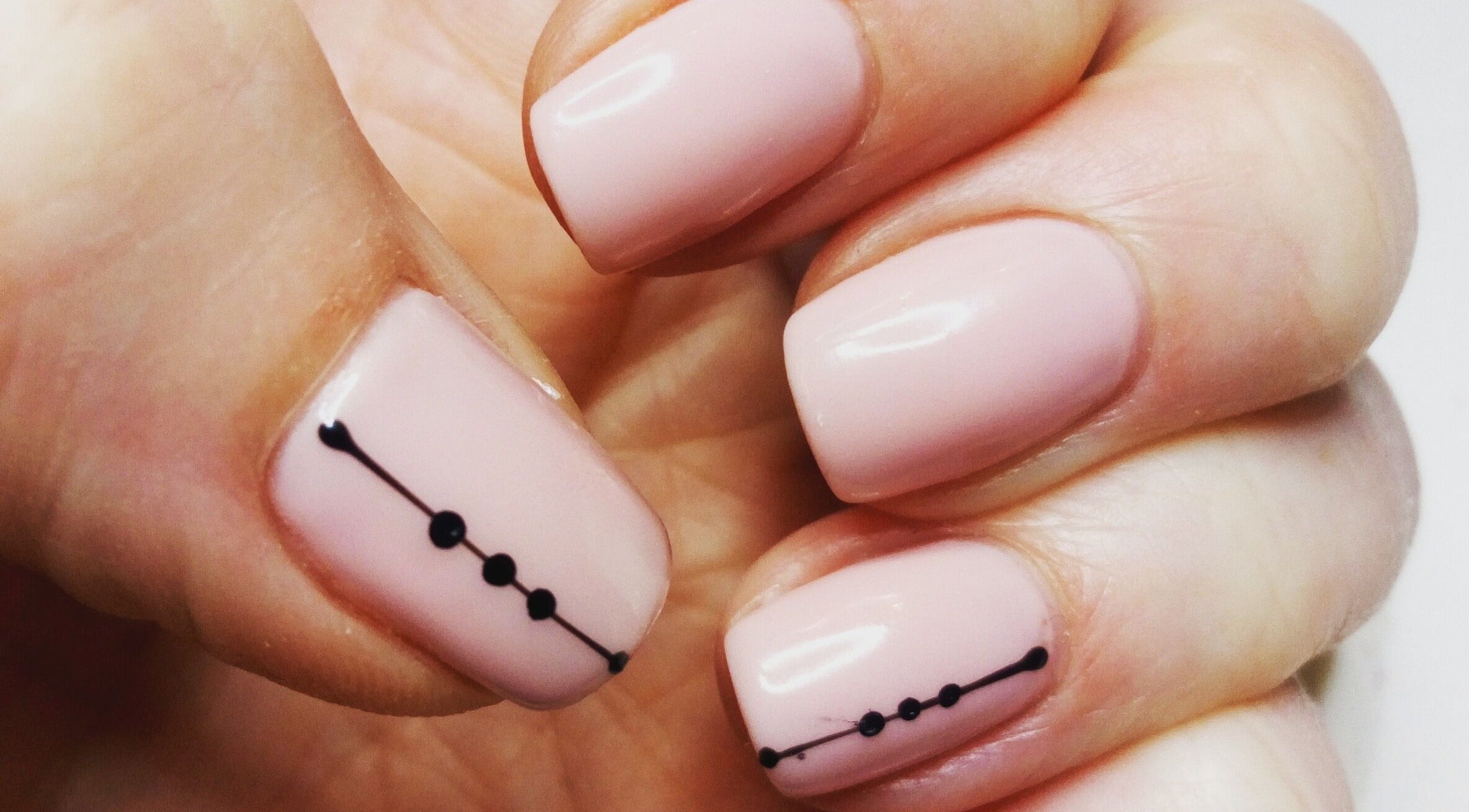 Elegant nail art with black dots at Haven Beauty Clinic, Nenagh, County Tipperary, IE.