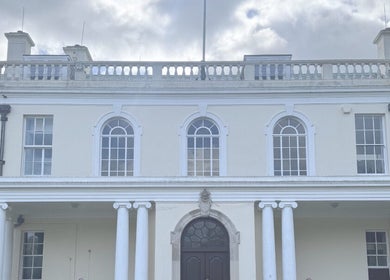 Elegant entrance of Chill Well-Being in Maidstone, England, GB, featuring grand columns and arch windows.