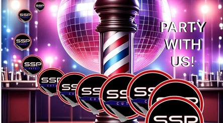 Vibrant party atmosphere at SSP Barber & Beauty, Inc. in Rincon, Georgia, US featuring barbershop pole.