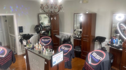 Modern interior of SSP Barber & Beauty, Inc. in Rincon, Georgia, US, featuring styling stations and professional tools.