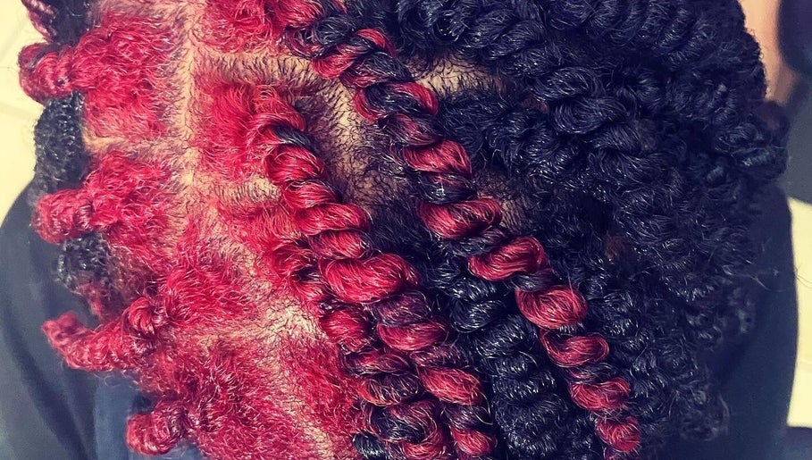 Close-up of vibrant red and black hair twists at Passion Hair Solutions, Lanham, Maryland, US.