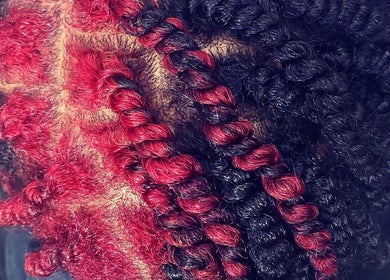 Close-up of vibrant red and black hair twists at Passion Hair Solutions, Lanham, Maryland, US.