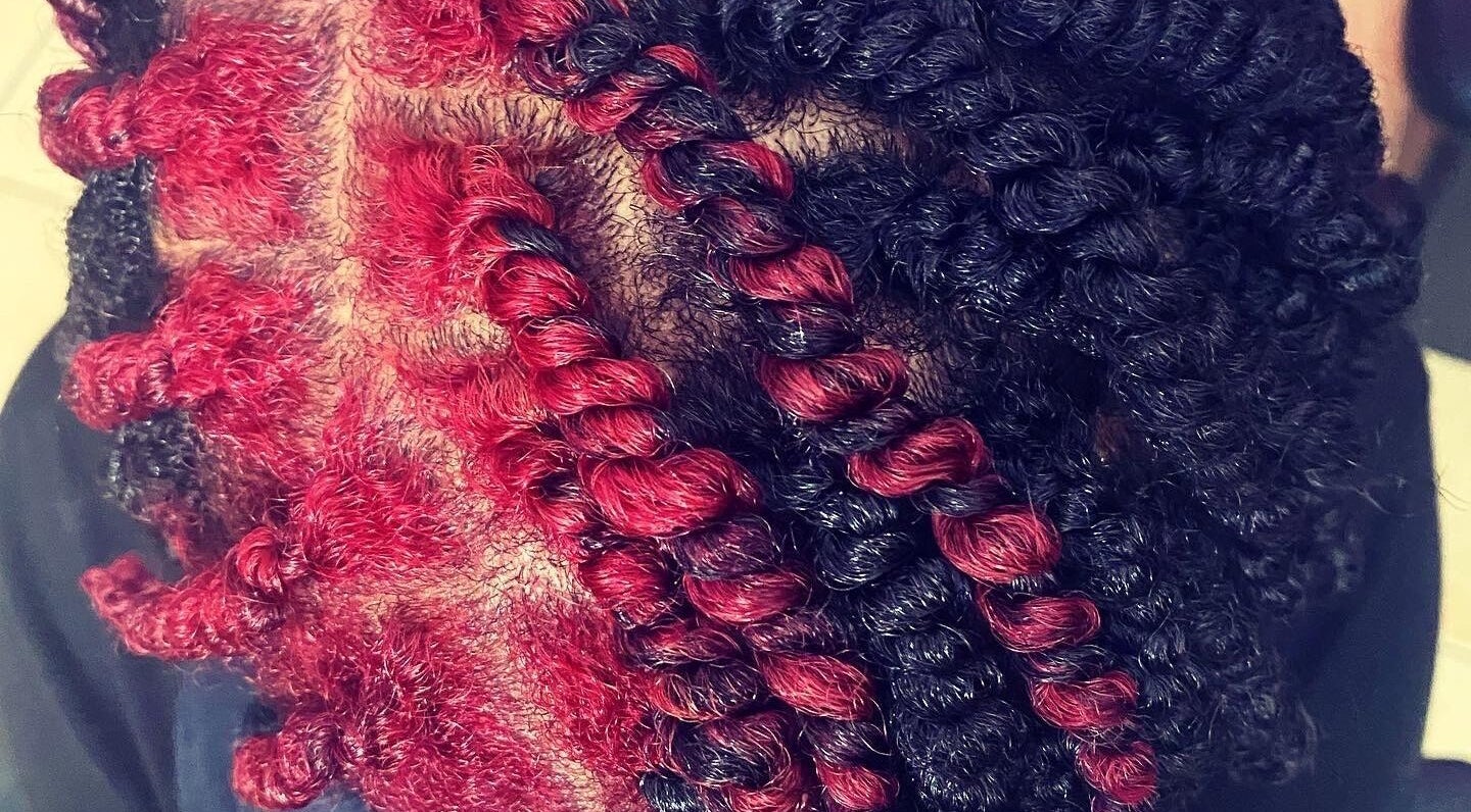 Close-up of vibrant red and black hair twists at Passion Hair Solutions, Lanham, Maryland, US.