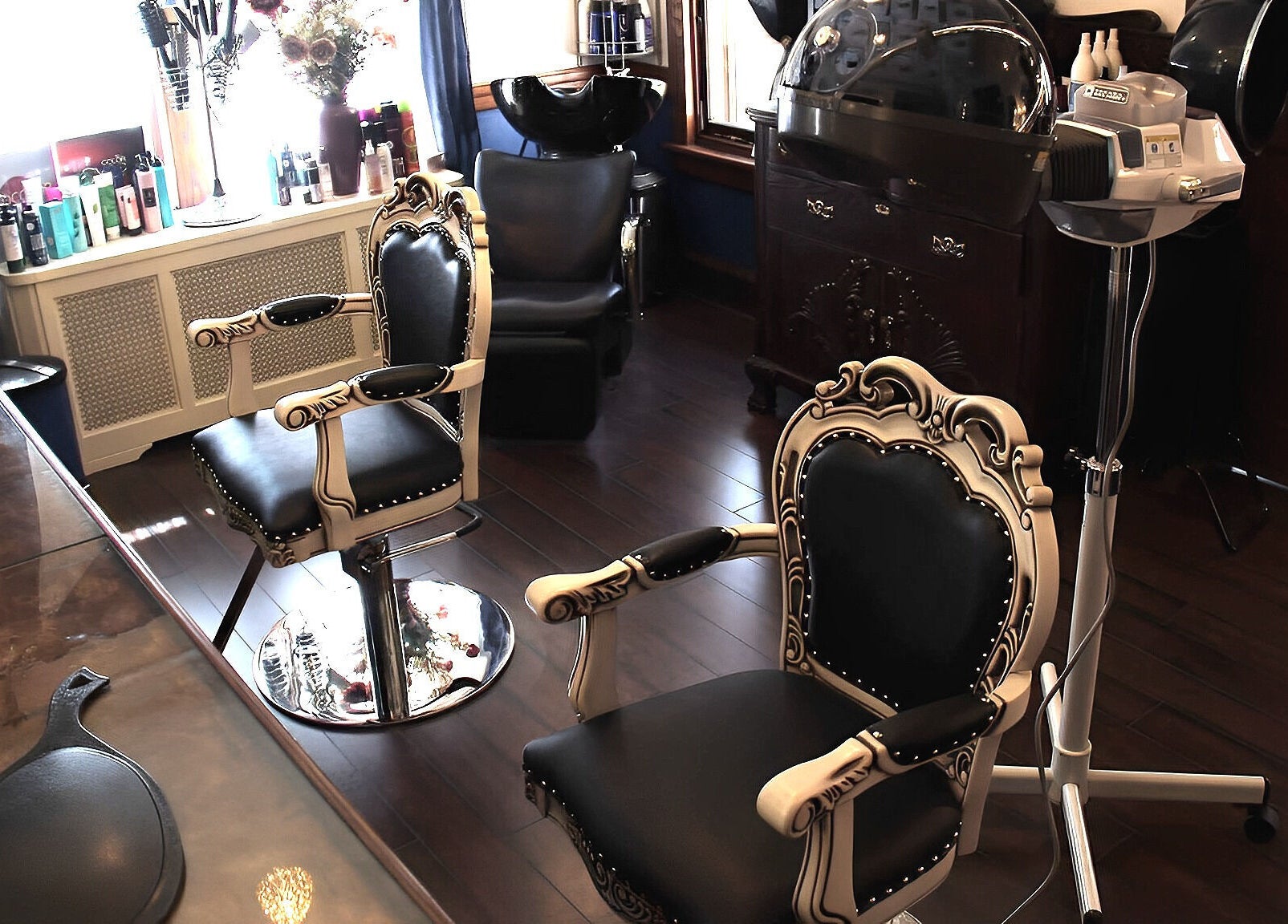 Elegant styling chairs inside TKM Hair Design and Restorations in Reading, Pennsylvania, US for a premium experience.