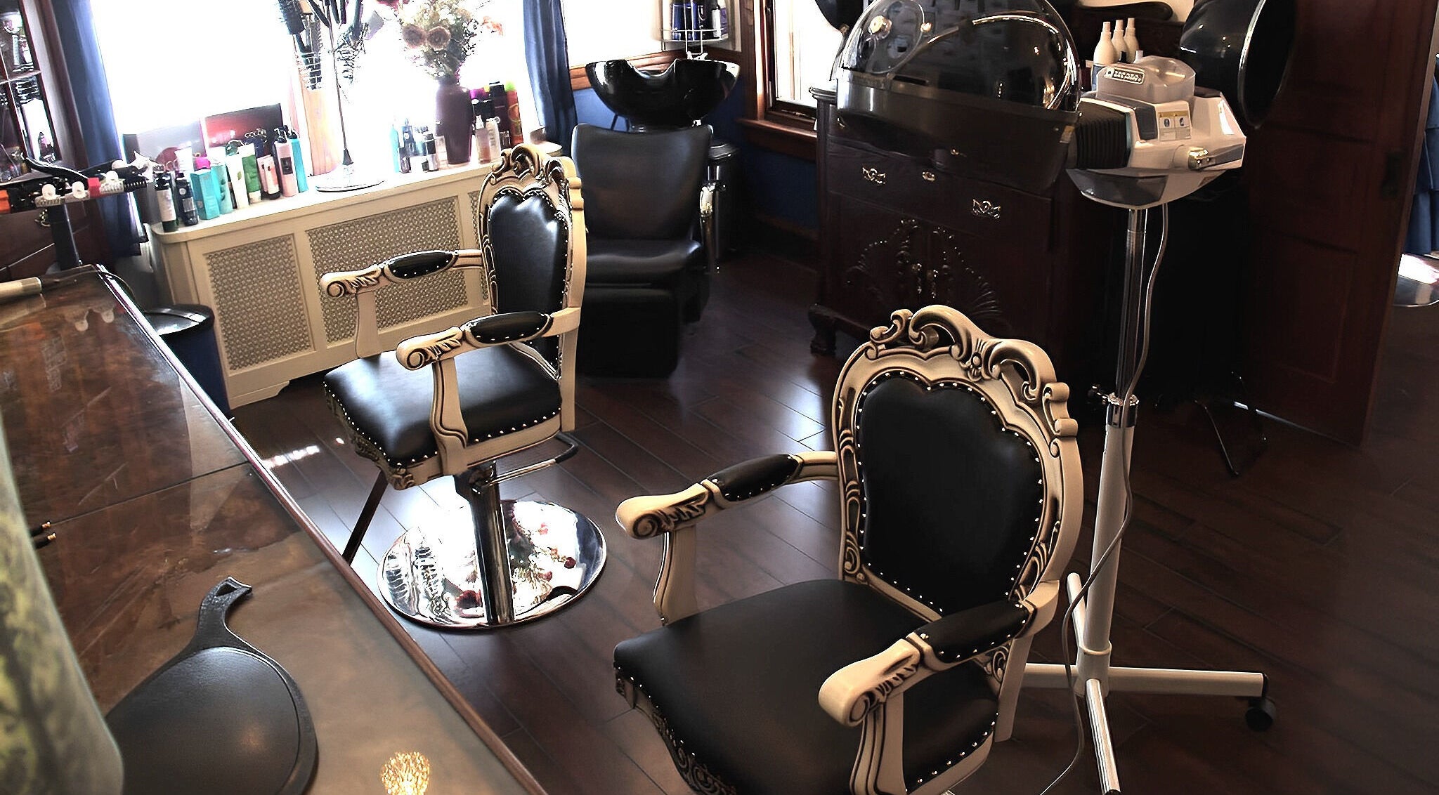 Elegant styling chairs inside TKM Hair Design and Restorations in Reading, Pennsylvania, US for a premium experience.