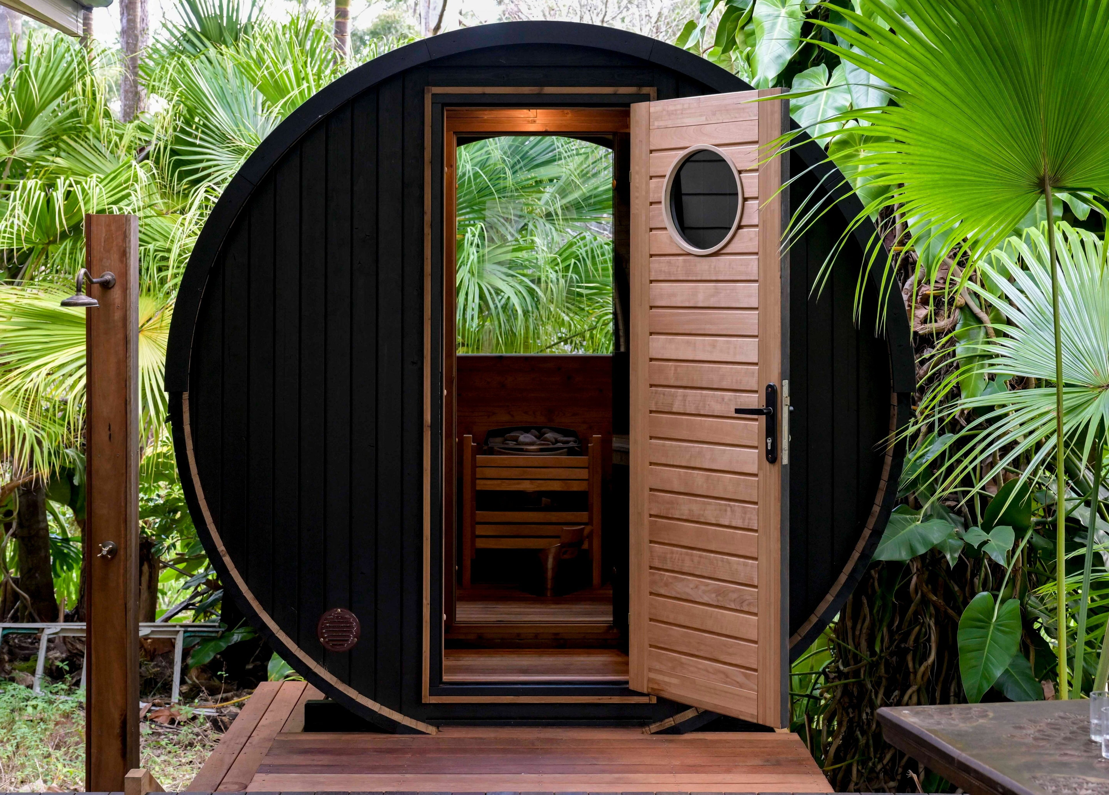Cozy outdoor sauna amidst lush greenery at Cloud 9 Sauna, Macmasters Beach, New South Wales, AU.