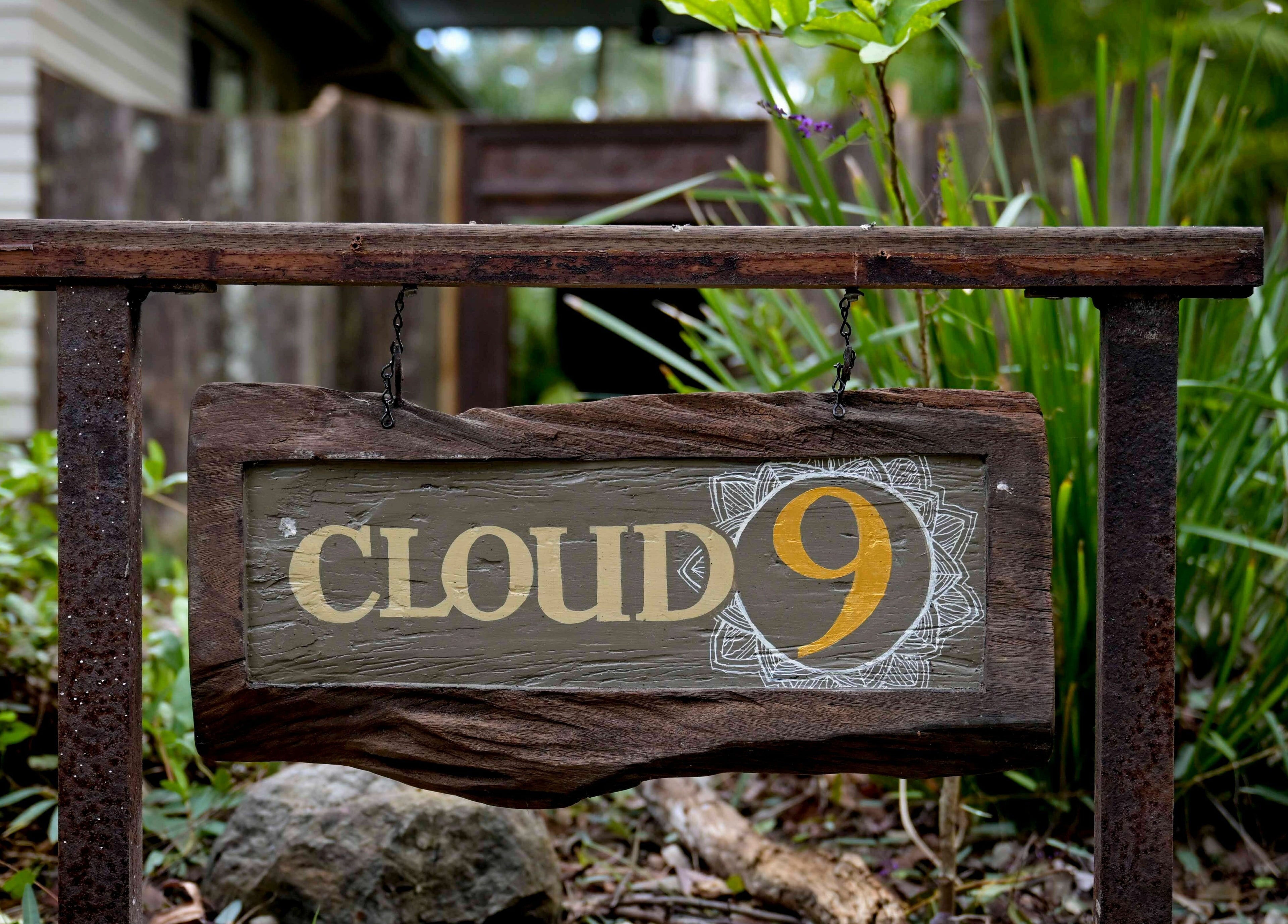 Entrance sign for Cloud 9 Sauna at Macmasters Beach, New South Wales, AU, welcoming visitors.