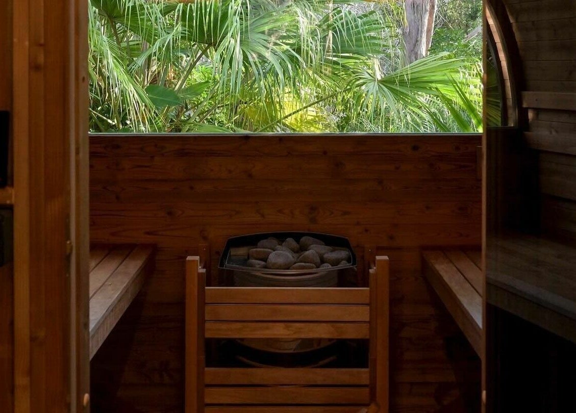Relaxing interior of Cloud 9 Sauna at Macmasters Beach, New South Wales, AU with a tropical view.