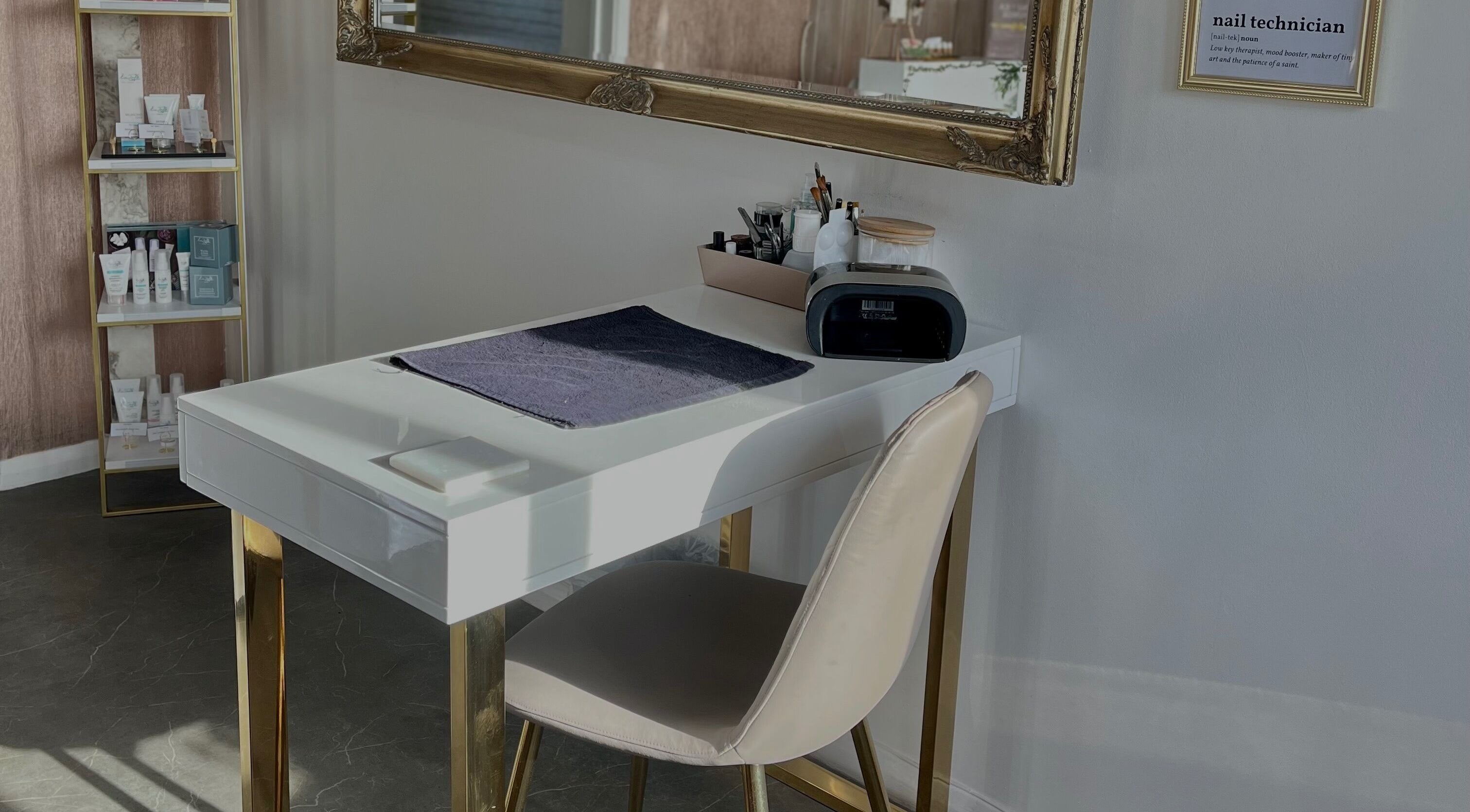 Elegant nail station at BeauTea Lounge in Norwich, England, GB with mirror and product display.