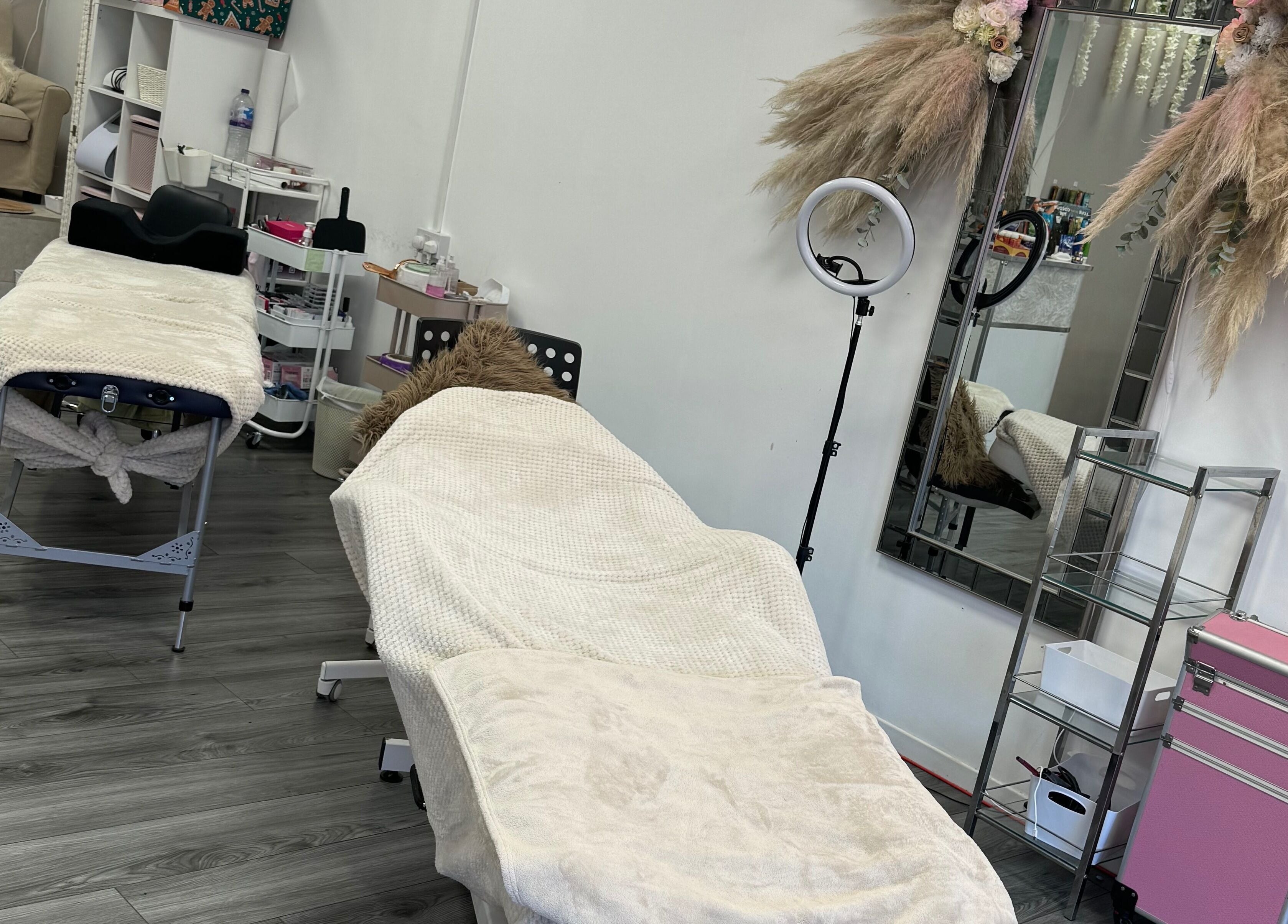 Treatment room at CJP Nail And Beauty Bar in Havant, England, GB featuring cozy massage beds and elegant decor.