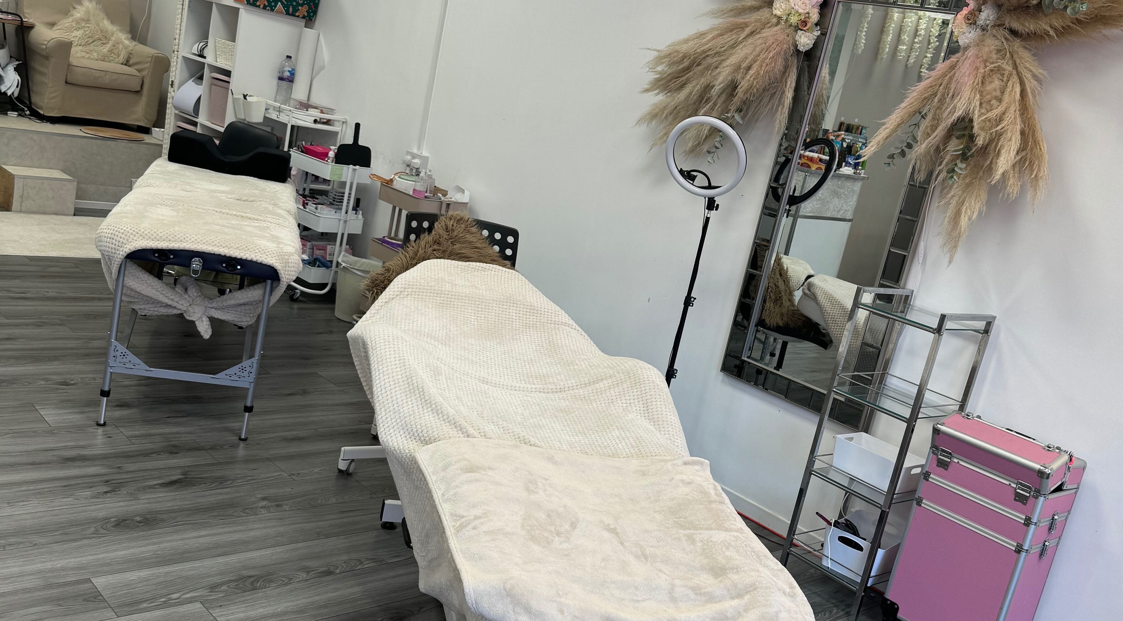 Treatment room at CJP Nail And Beauty Bar in Havant, England, GB featuring cozy massage beds and elegant decor.