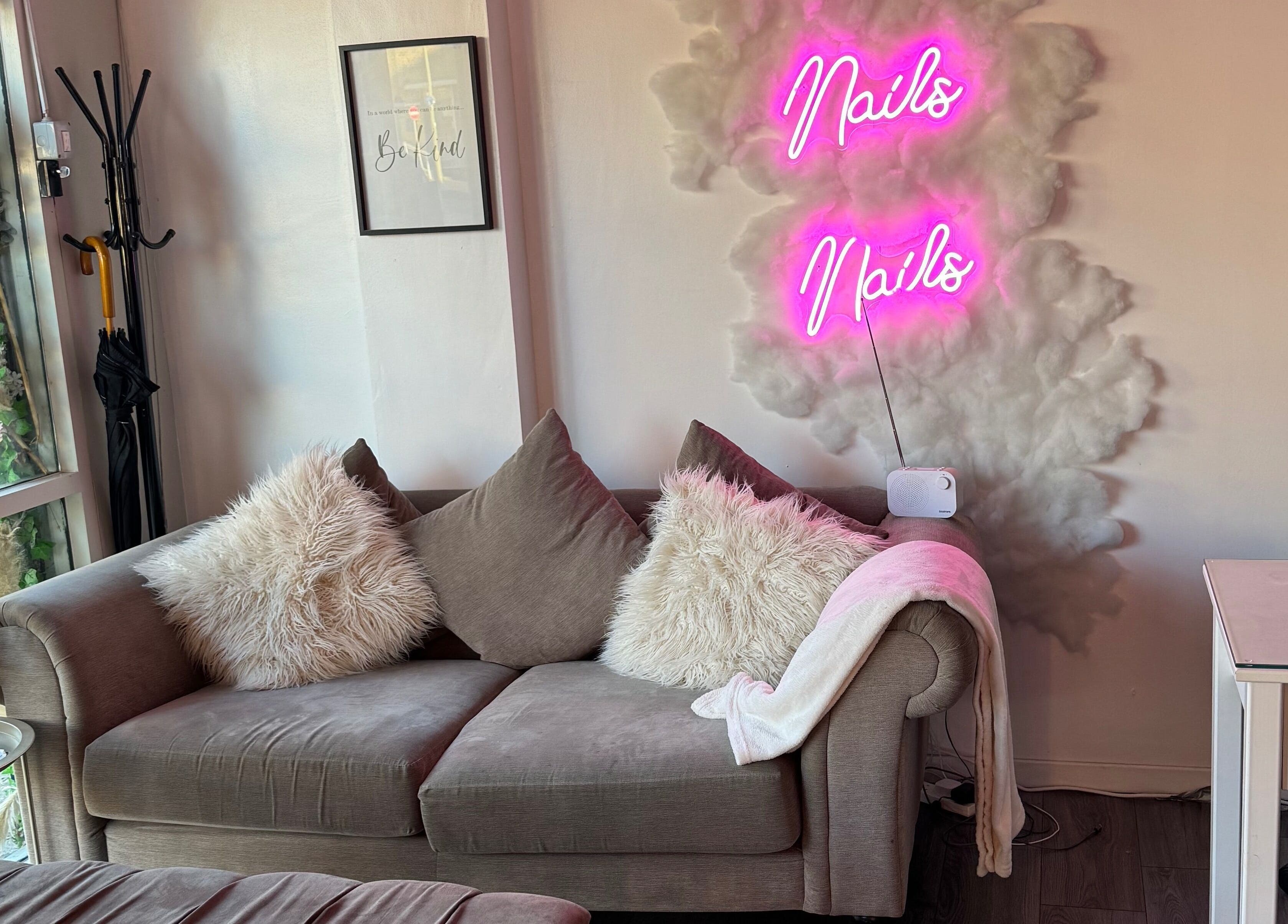 Cozy seating with neon lights at CJP Nail And Beauty Bar, Havant, England, GB.