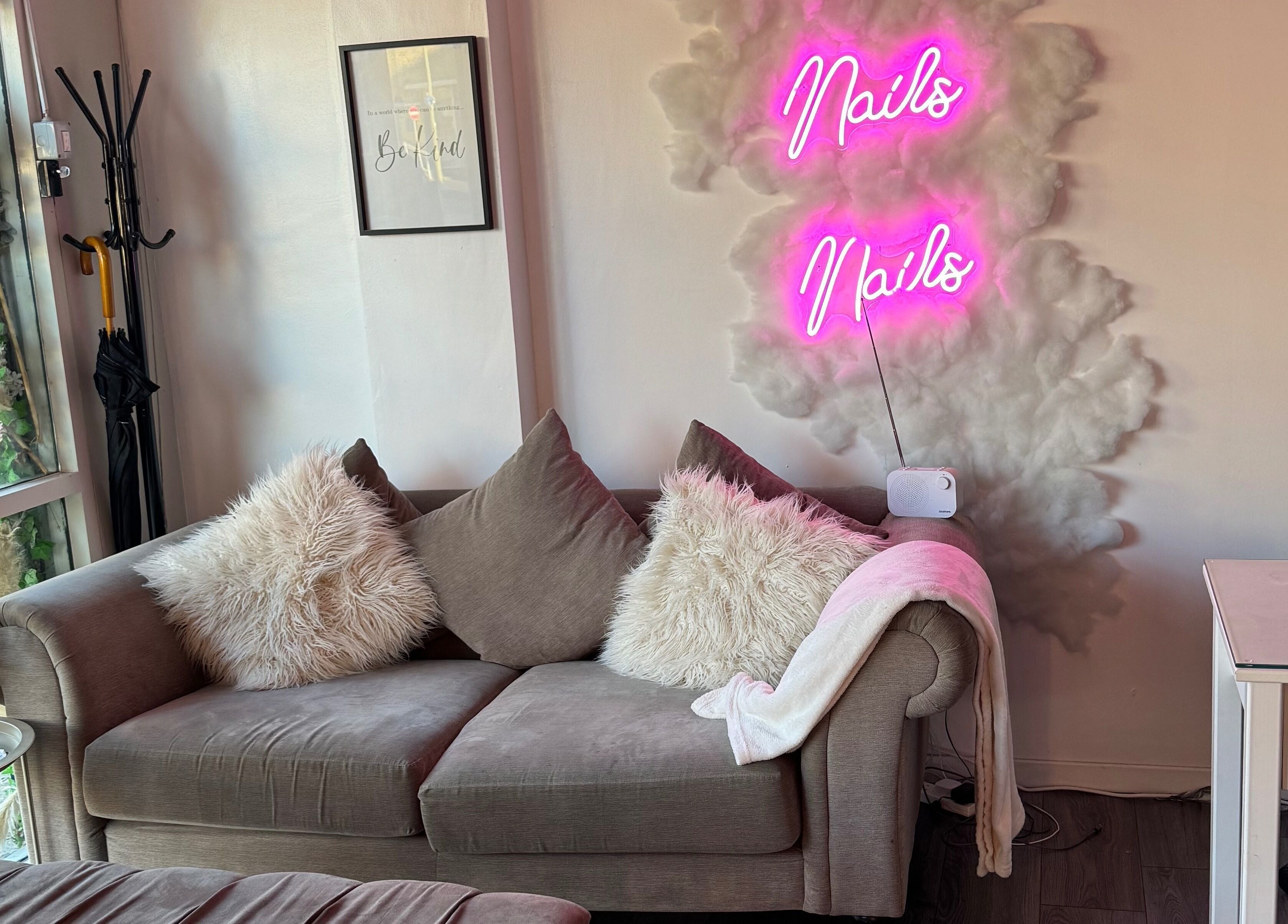 Cozy seating with neon lights at CJP Nail And Beauty Bar, Havant, England, GB.