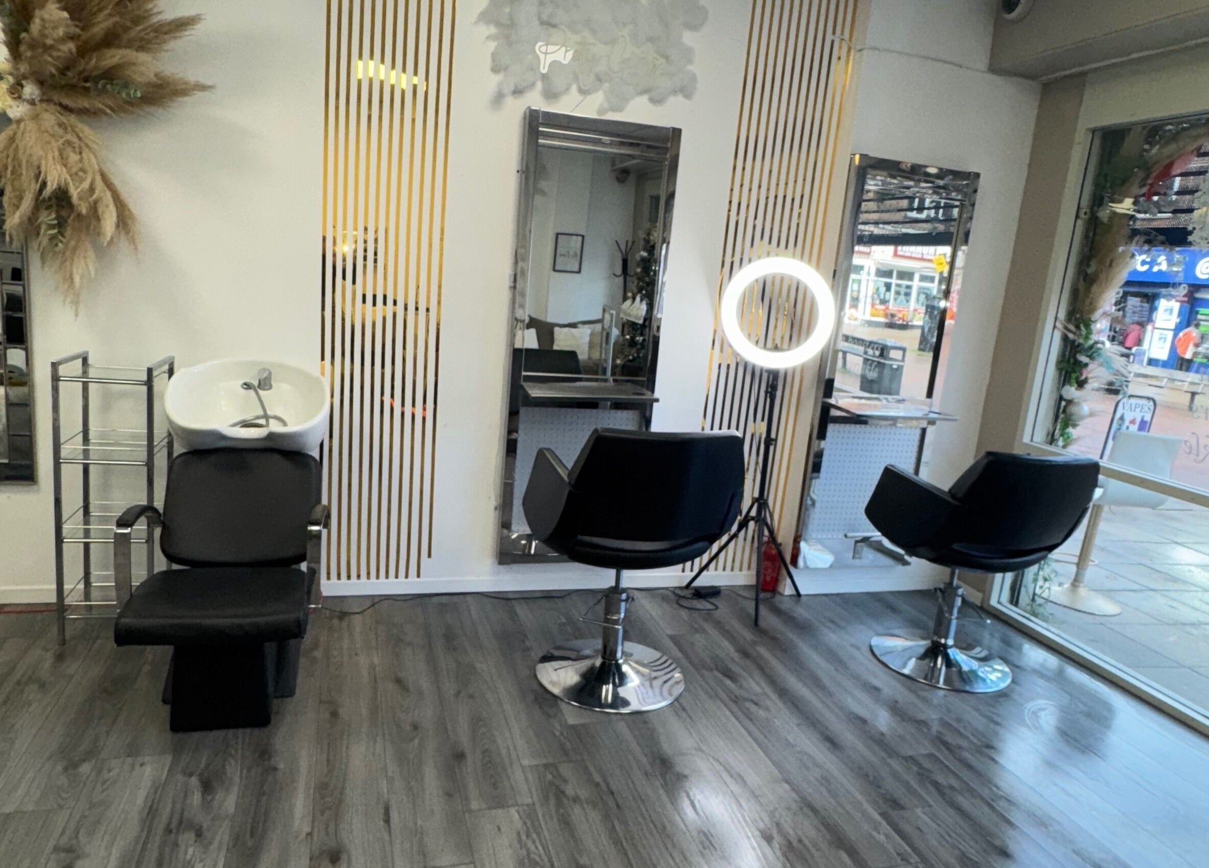 Sleek interior of CJP Nail And Beauty Bar with styling chairs in Havant, England, GB.
