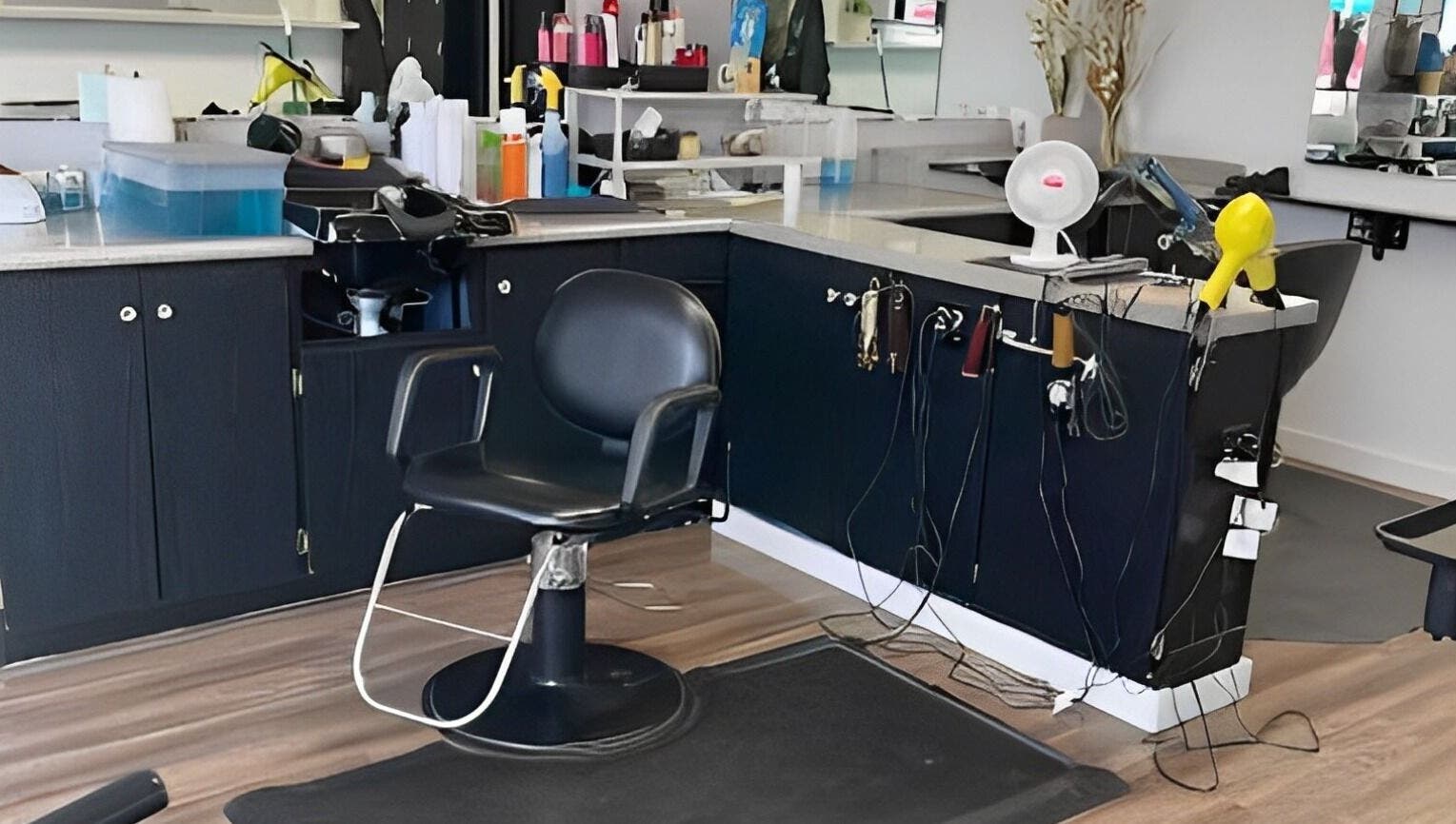 Stylish salon station at Willow's Place, Caldwell, Idaho, US, with modern hairdressing chair and equipment.