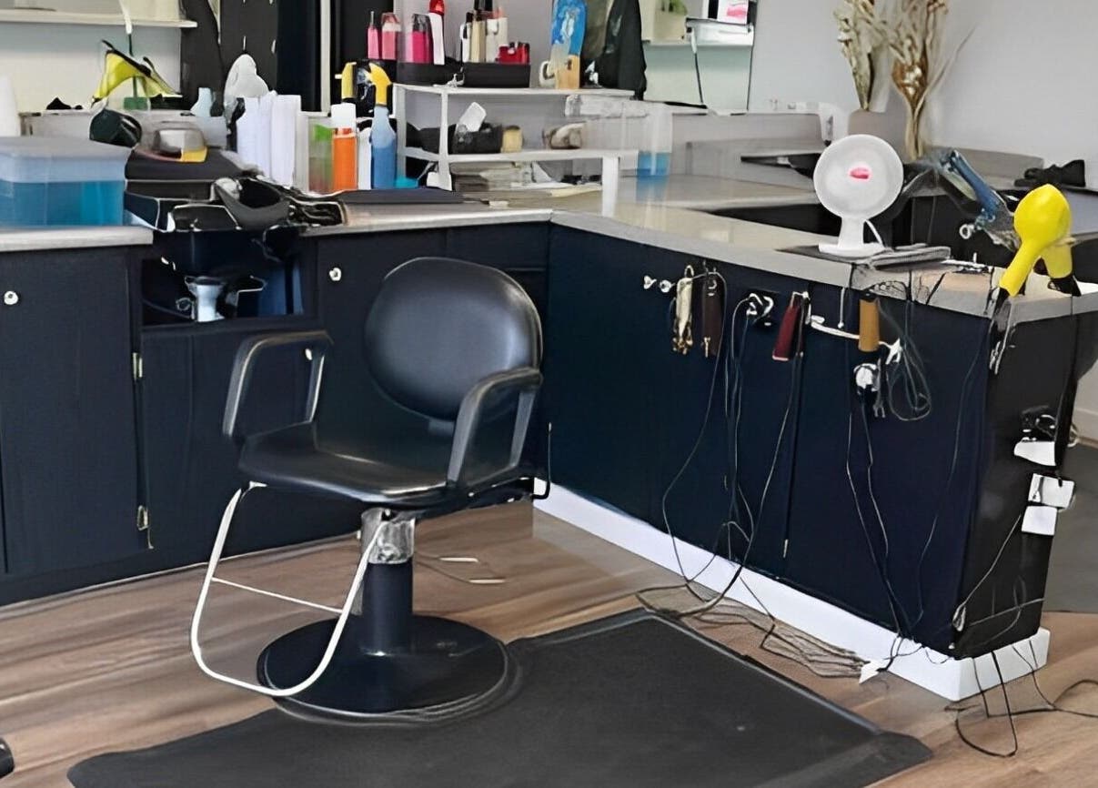 Stylish salon station at Willow's Place, Caldwell, Idaho, US, with modern hairdressing chair and equipment.
