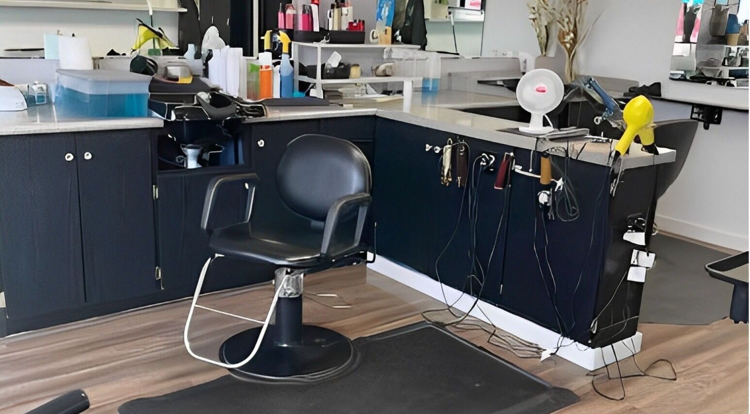 Stylish salon station at Willow's Place, Caldwell, Idaho, US, with modern hairdressing chair and equipment.