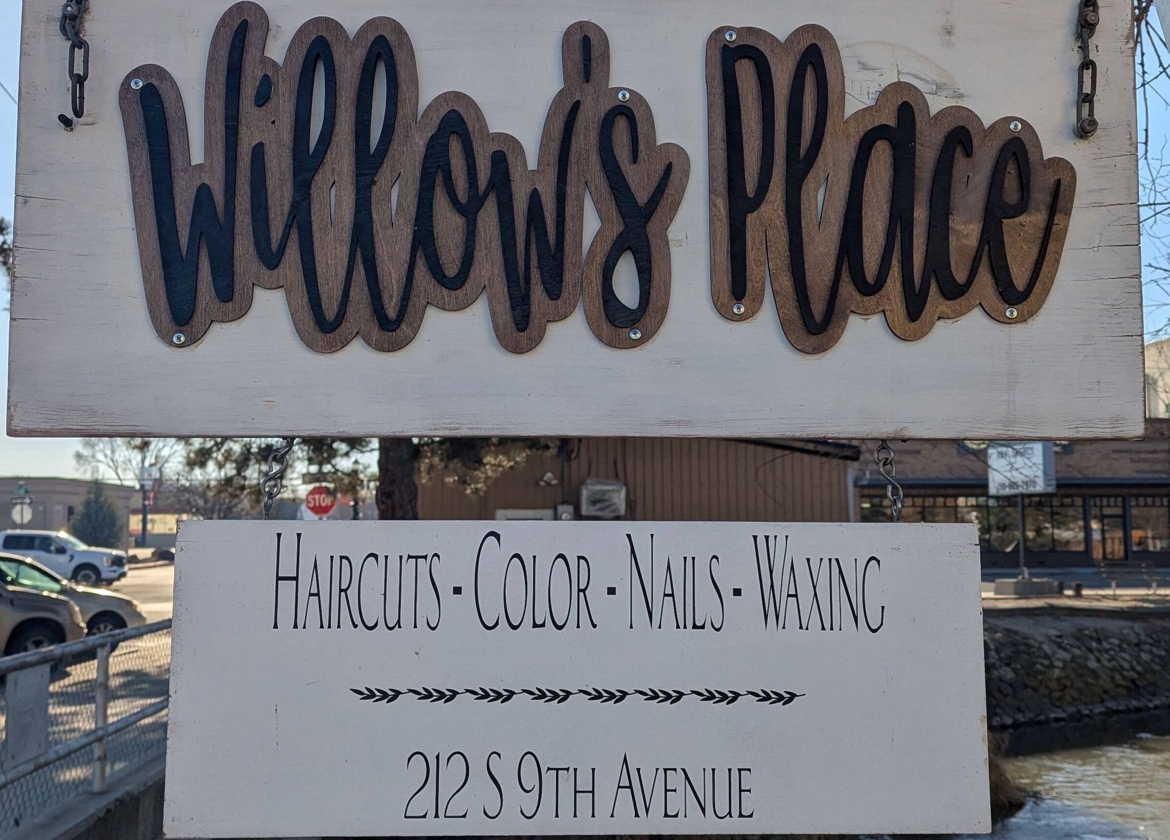 Entrance sign of Willow's Place, a beauty salon in Caldwell, Idaho, US, offering haircuts and more.