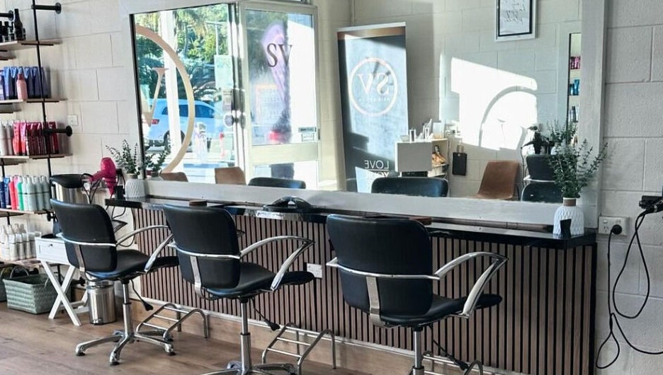 Modern salon at SV Hair Design in Gladstone Central, Queensland, AU with stylish seating and hair products.