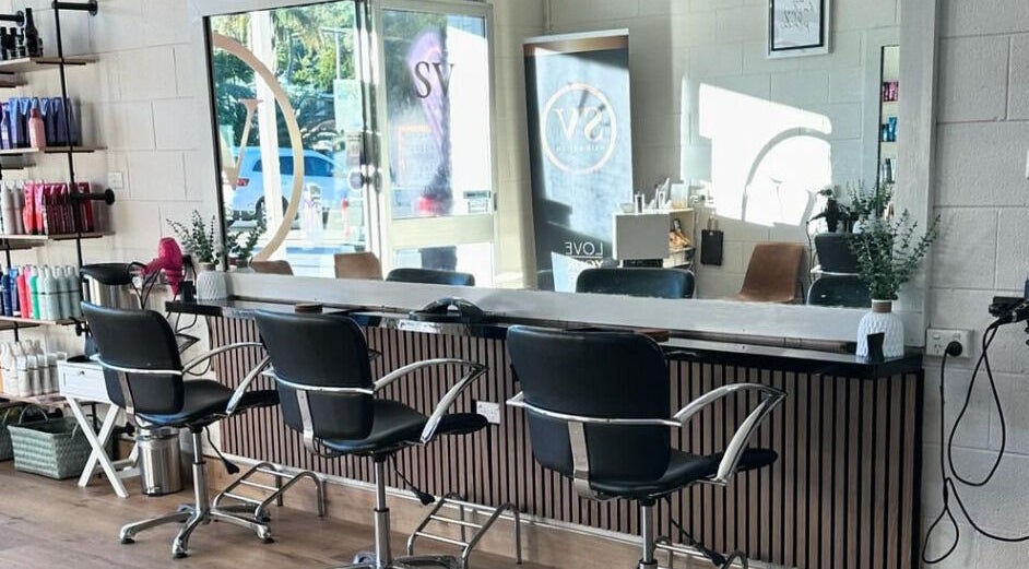 Modern salon at SV Hair Design in Gladstone Central, Queensland, AU with stylish seating and hair products.