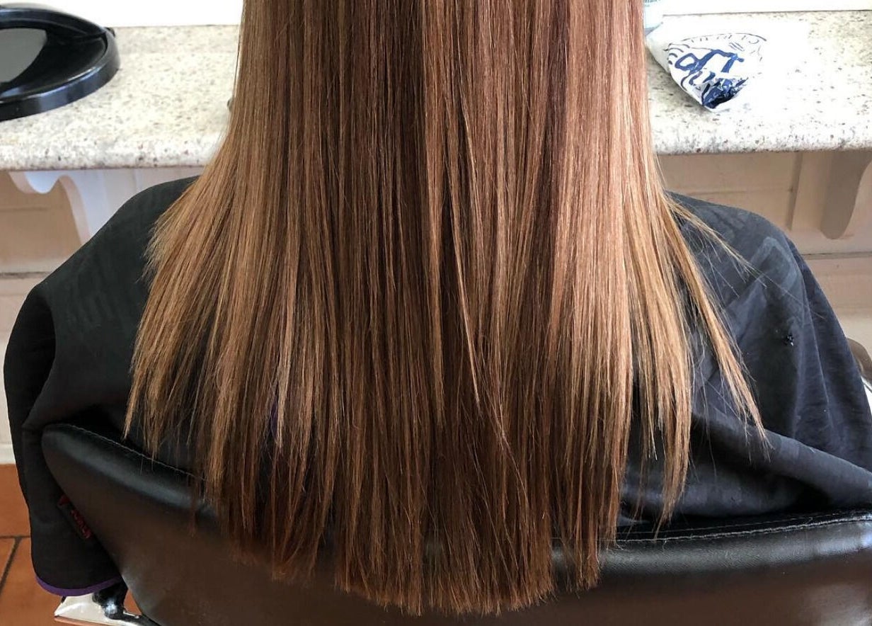 Back view of smooth, straightened hair at SV Hair Design, Gladstone Central, Queensland, AU.